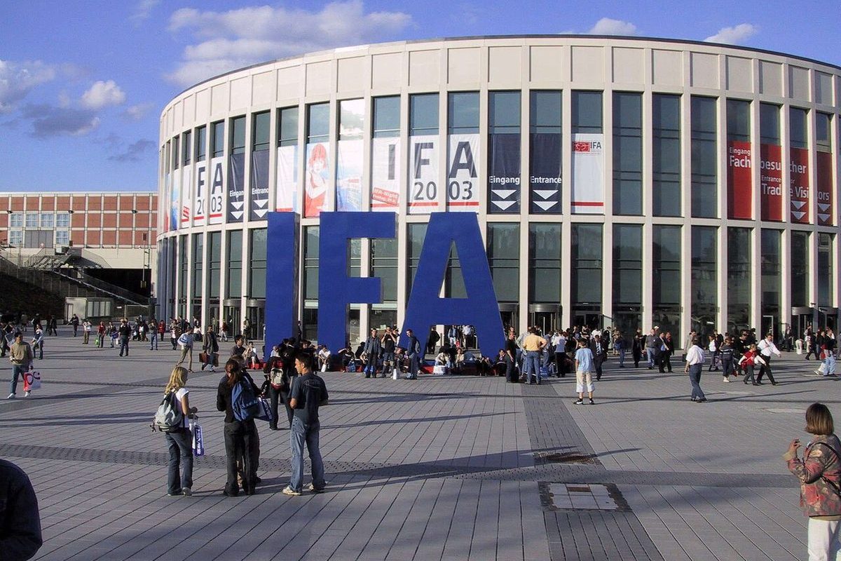 Berlin exhibition hall exterior at twilight with Funkturm tower in background