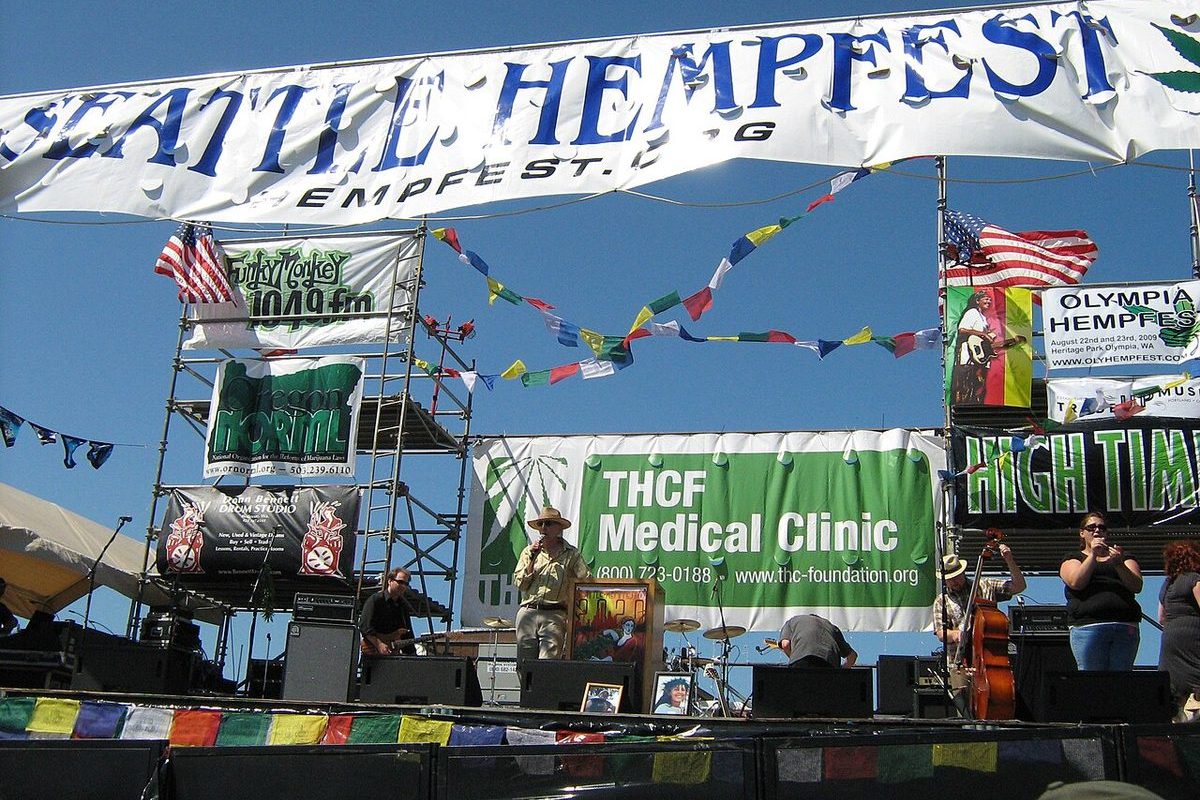 Seattle waterfront park with distant outdoor stage and Olympic Mountains